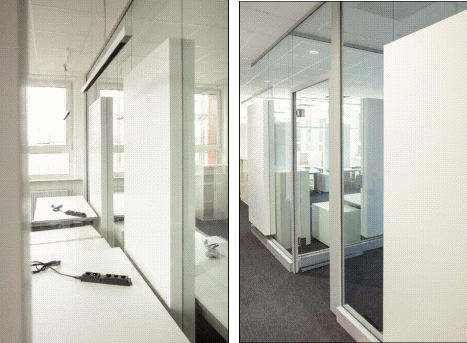 Zusatznutzen von Lärmminderung am Arbeitsplatz Innenansicht eines Bueros mit transparenten, raumhohen Glas-Akustikwaenden